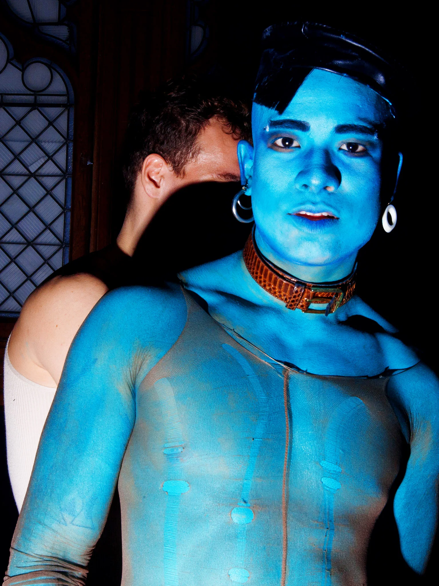 Performer in blue body paint